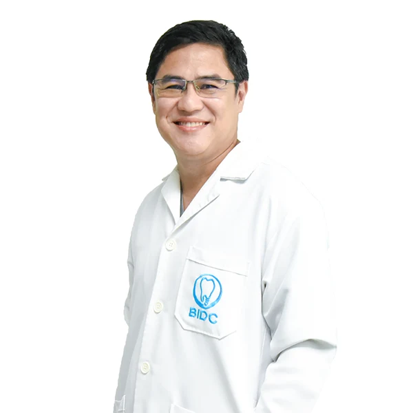 Dr. Chalumpol Ketpichai DDS.,